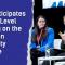 On the right side an image is shown of three people sitting on stage during a panel discussion at a high-level meeting, with a blue torn-paper graphic on the left side displaying the text: 'ESN participates in High-Level meeting on the European University Initiative.'