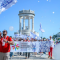 A group of people with colourful flags in front of Pasetto in Ancona, Italy.