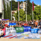 A picture of a big group of people with different ESN and country flags.