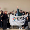 A group picture of young people holding an ESN flag.