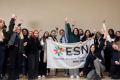 A group picture of young people holding an ESN flag.